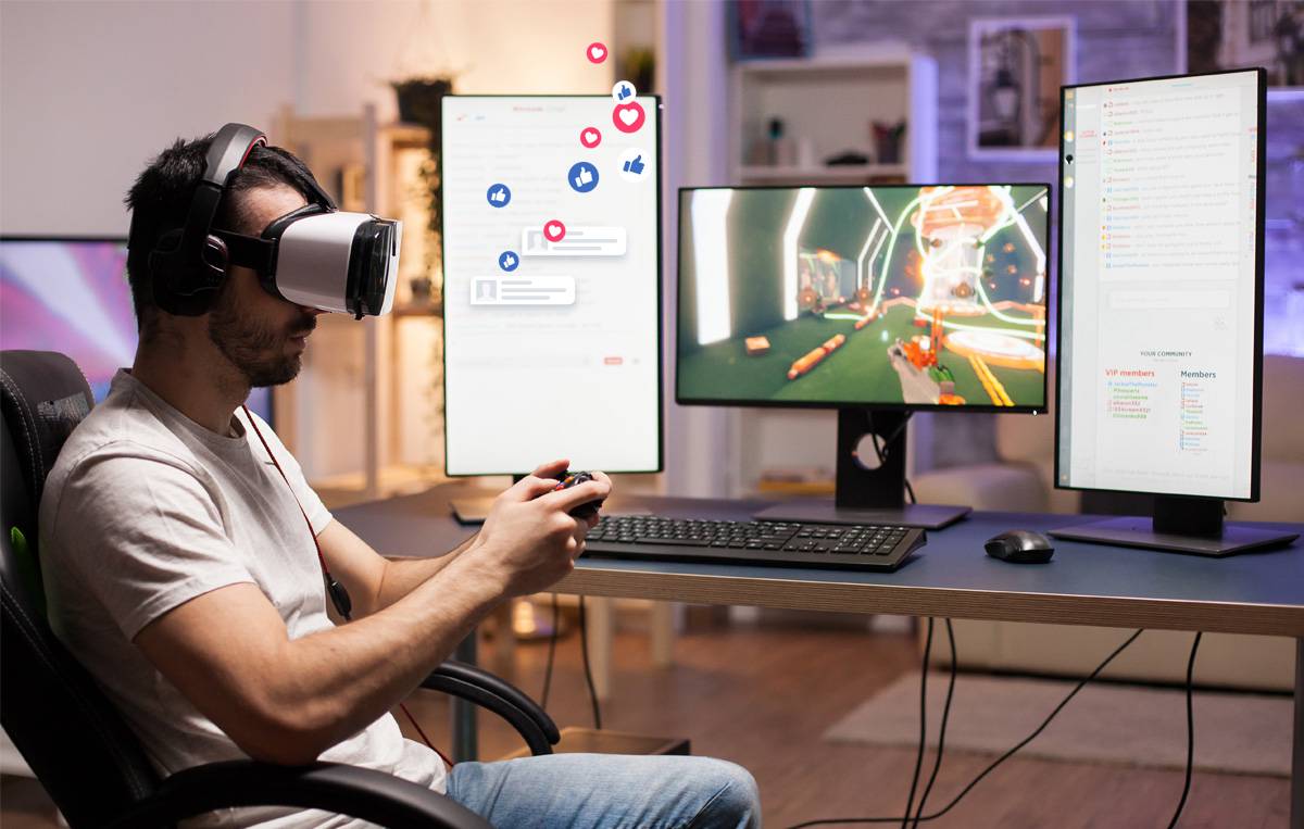 A gamer in a headset uses a controller while engaged with a VR game, surrounded by dual monitors displaying social media and chat interactions.
