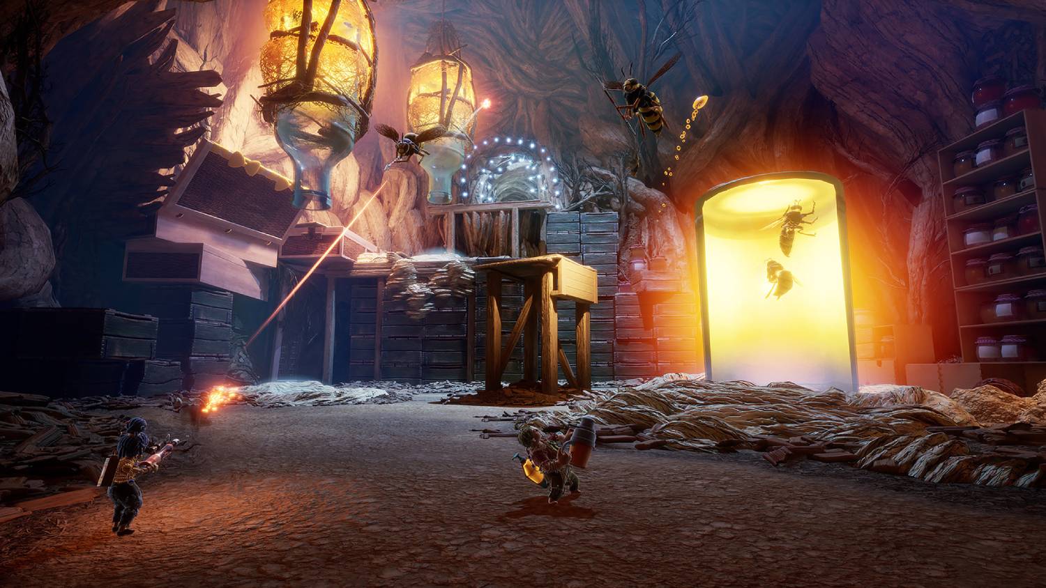  Two small characters battle giant bees in a vibrant cave with glowing lanterns and jars, amidst scattered crates and debris.
