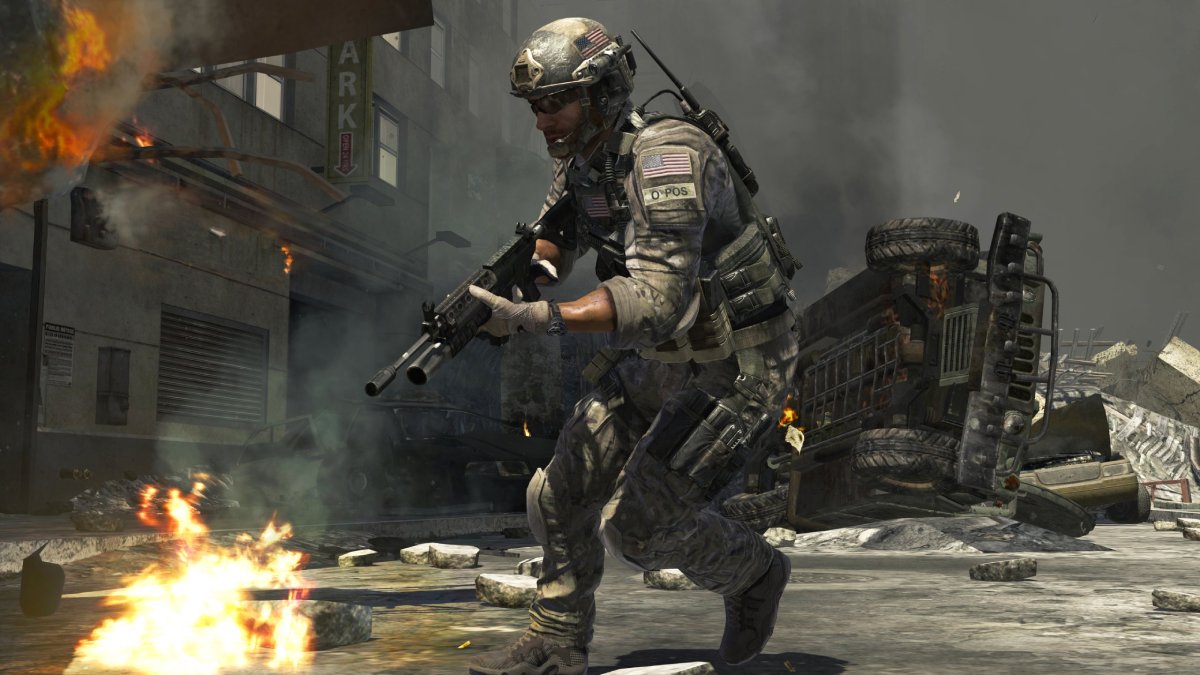 Soldier in combat gear running through a war-torn urban environment with a rifle, amidst flames and debris.